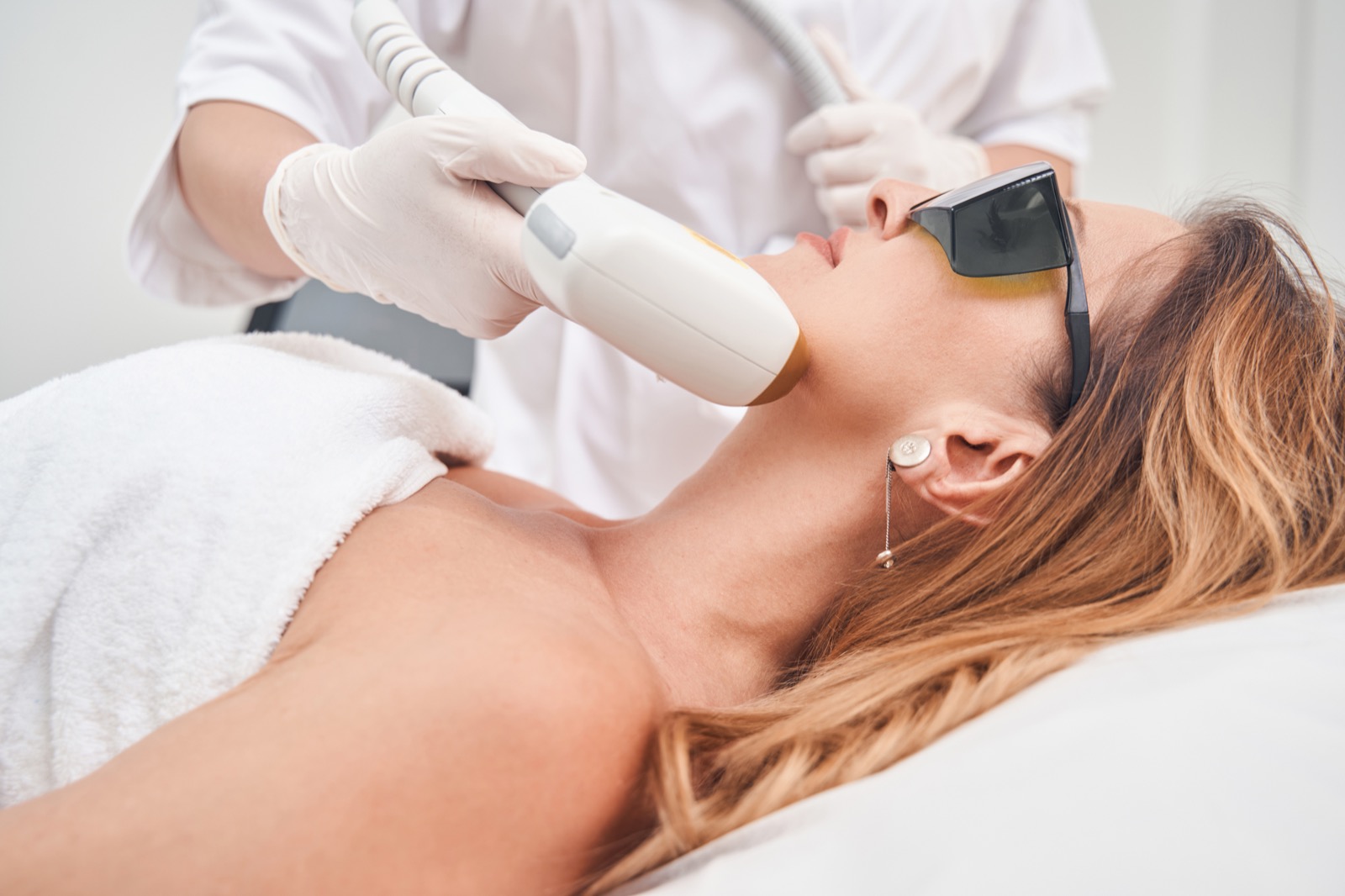 Laser hair removal treatment in progress