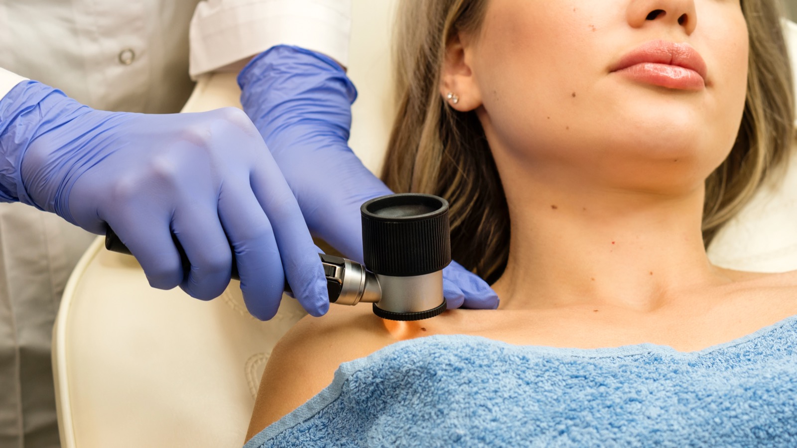 Dermatologist examining moles
